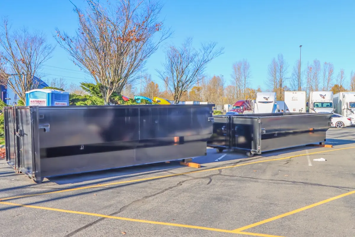 Professional dumpster rental service with roll-off container on residential driveway in Boerne